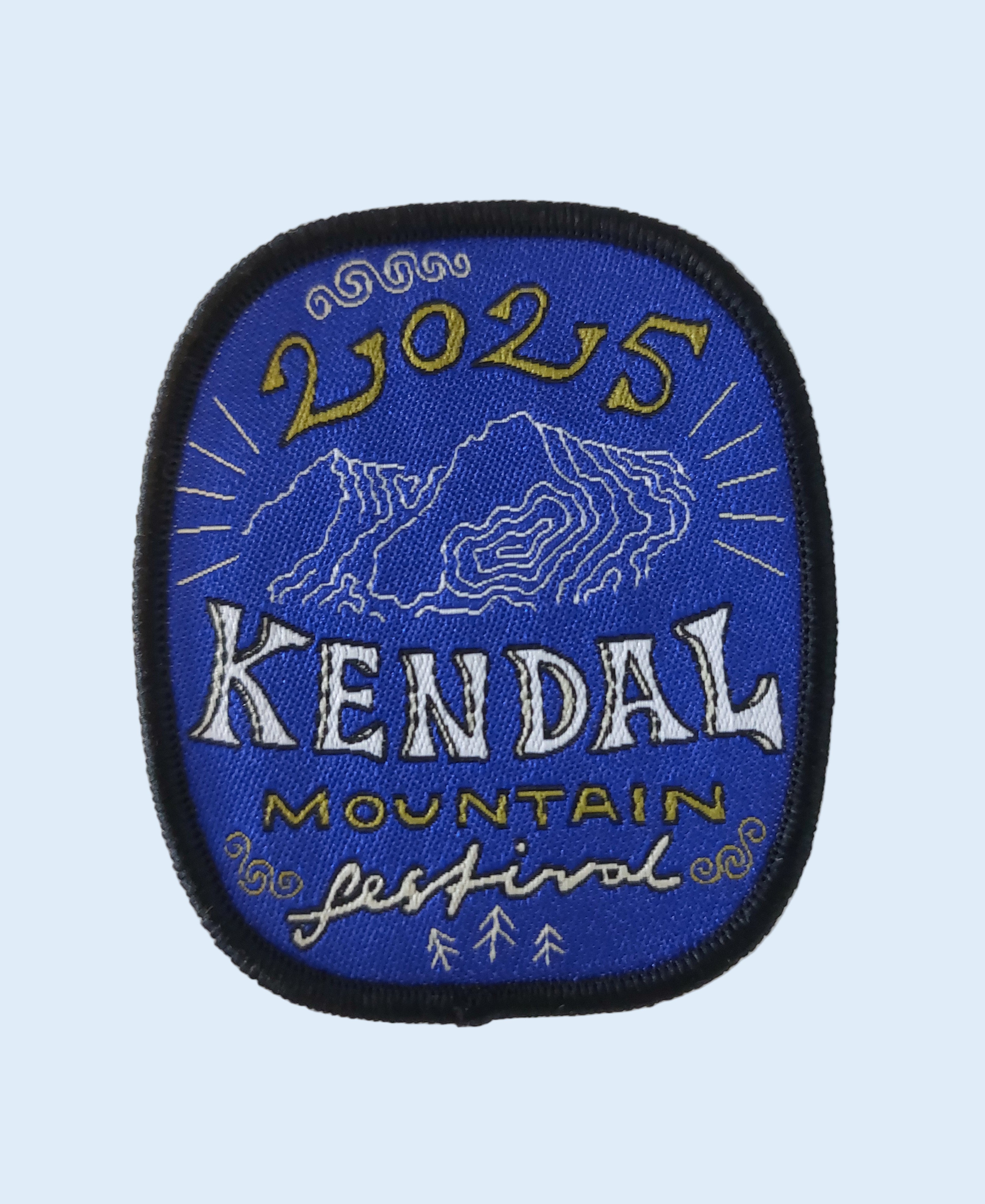 Embroidered patch with '2025 Kendal Mountain Festival' text on a blue background
